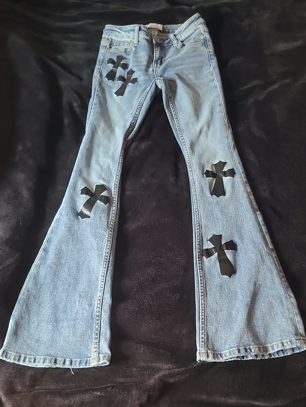 Light Blue Boot-Cut Jeans with Black Cross Appliqués (Austin Lang)